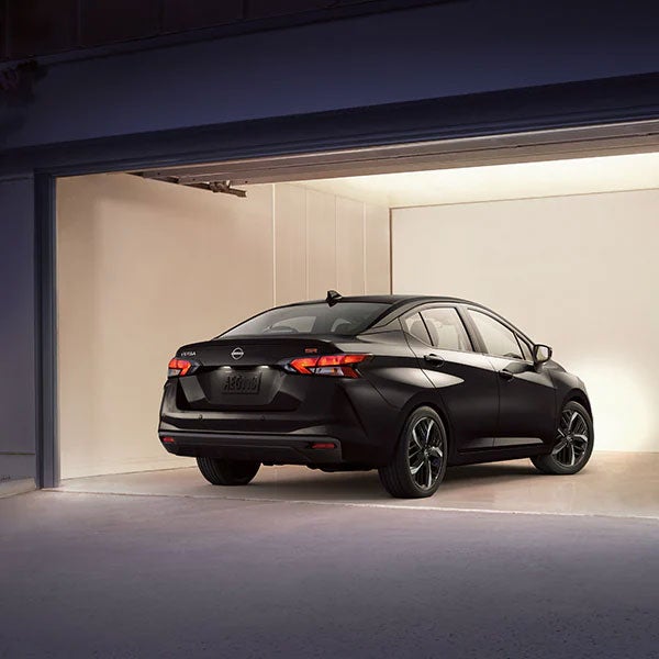 2024 Nissan Versa parked in a well-lit and otherwise empty garage
