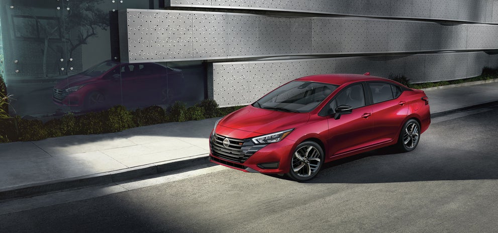 2024 Nissan Versa parked near a city street curb